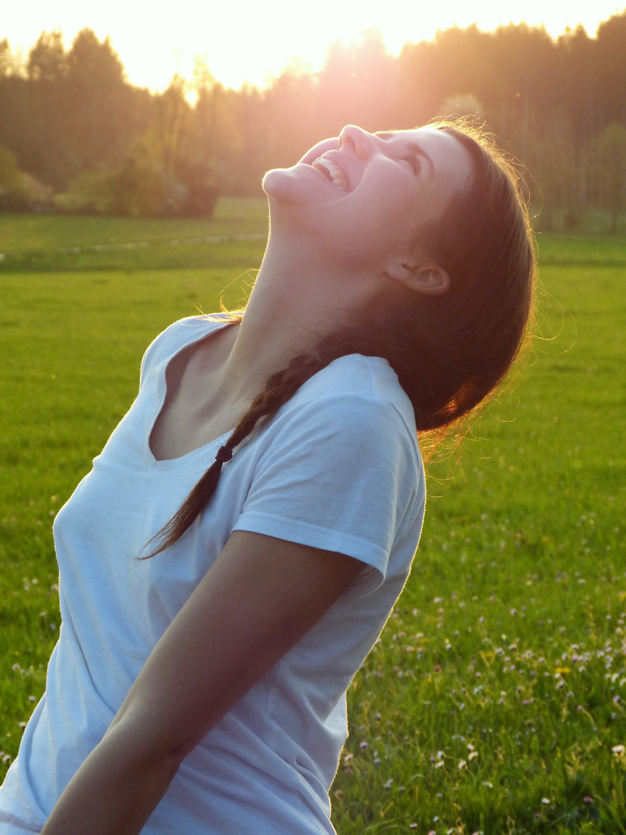 Woman Laughing in a Meadow